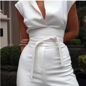 White sleeveless jumpsuit with adjustable belt